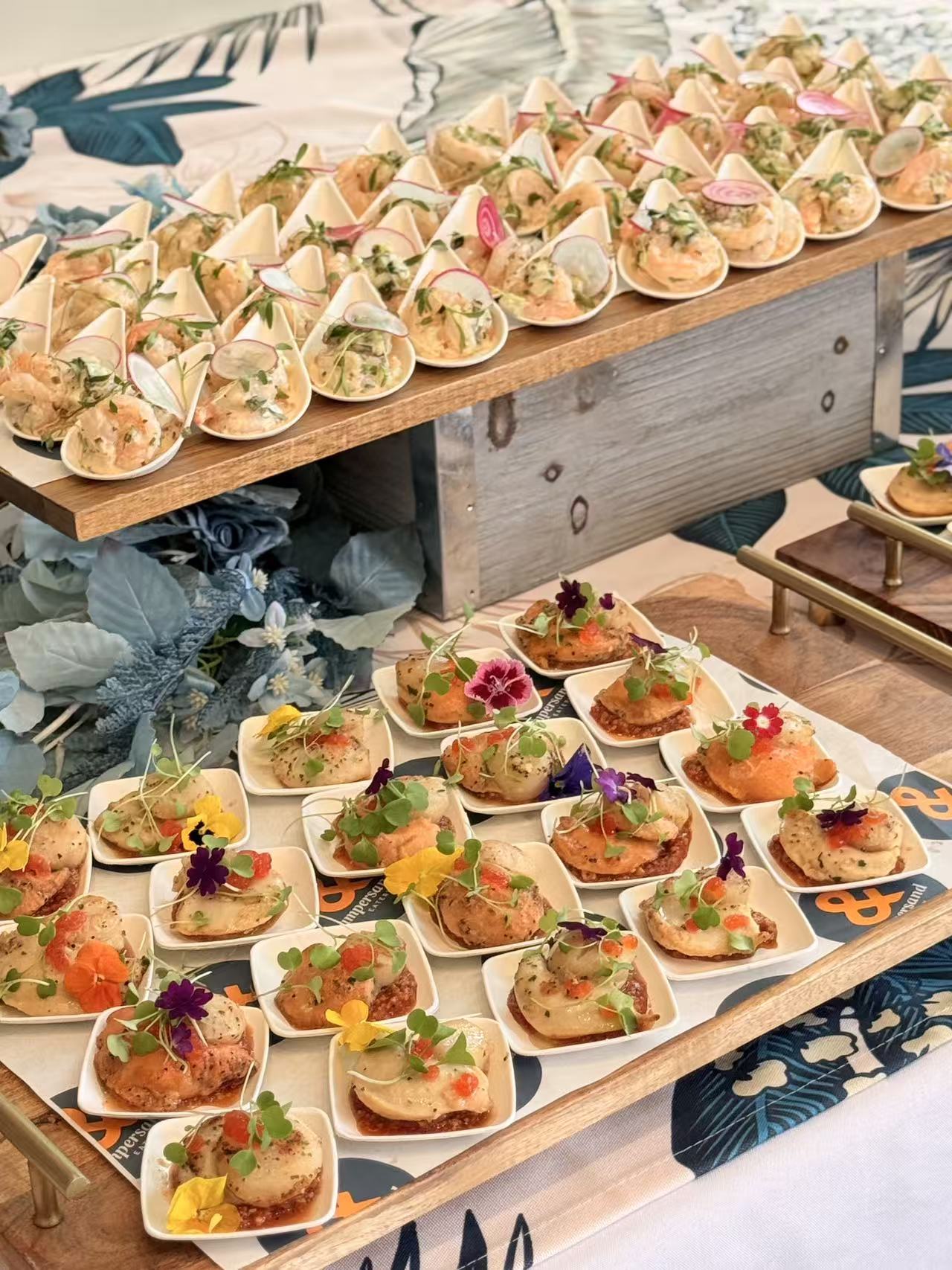 Prawn cones and scallop canapés with edible flowers